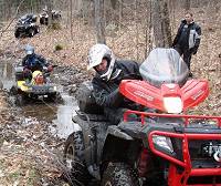 Polaris Sportsman with fairing and windshiel in action